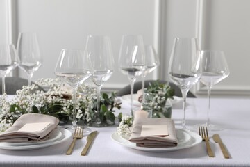 Beautiful table setting with floral decor indoors