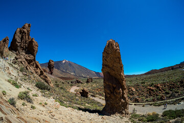 The lava fields of Las Canadas caldera of Teide volcano and rock formations - Roques de Garcia and...