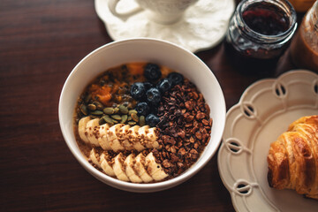 Smoothies, fruit with croissants and drinks