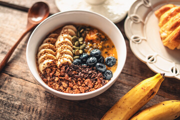 Smoothies, fruit with croissants and drinks