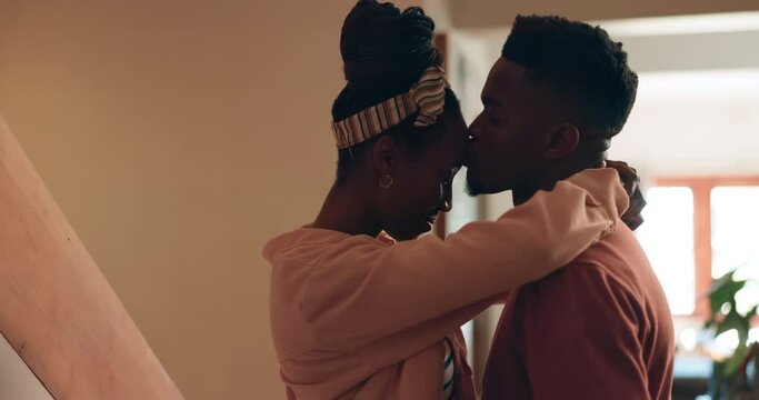 Dance, love and couple with forehead kiss, hug and support at home with trust, security and care. Gratitude, embrace and happy black people share intimate moment with music, respect or radio in house