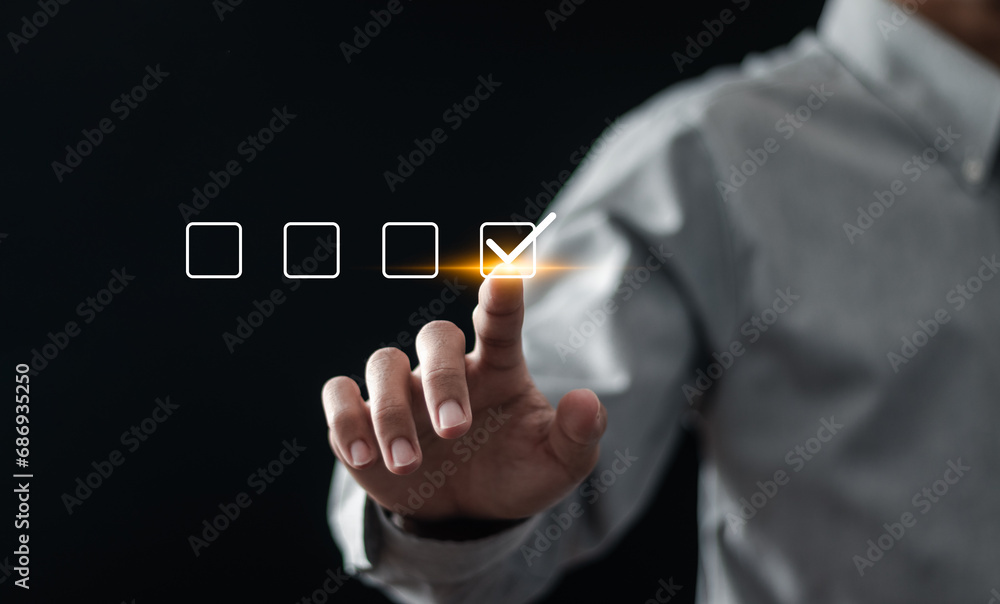 Aufkleber checklist concept. businessman tiking checking mark in checkboxes on virtual screen.