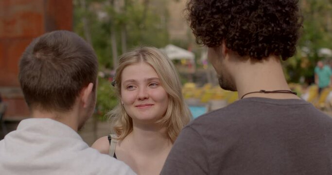 involve consensually and openly loving and connecting with multiple partners simultaneously. Girl and two guys. Romantic relationships among three individuals polyamory