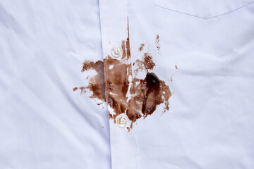 Dirty choclate stain on white shirt - obrazy, fototapety, plakaty