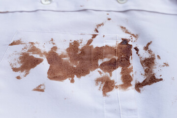 Dirty choclate stain on white shirt