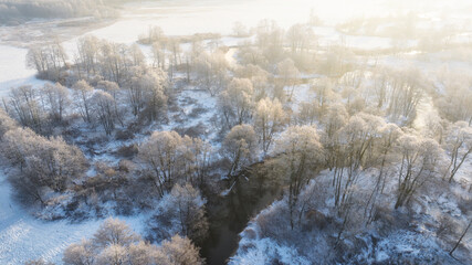 Winter landscape - white trees covered with hoarfrost and river - aerial view