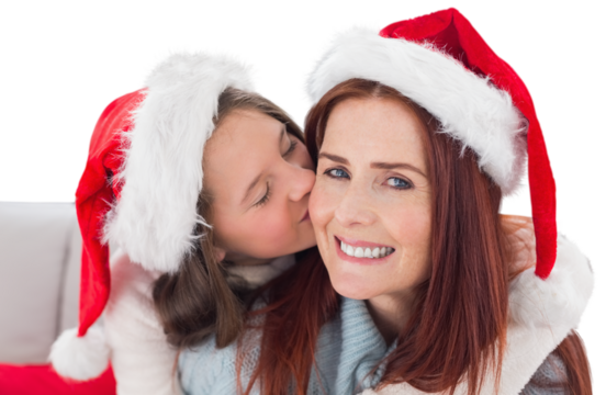 Digital png photo of happy caucasian mother and daughter in santa hats on transparent background