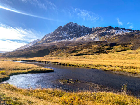 Stream Winding Through Scenic Icelandic Countryside
