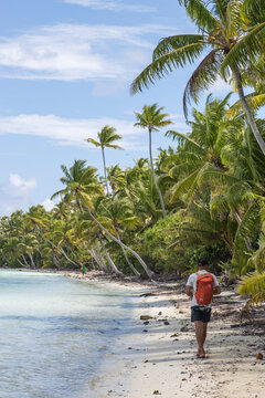 Walking down the beach on a remote tropical paradise on the white sand