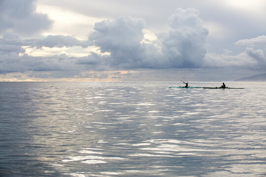 Kayaking into the sunset in Tahiti on the ocean