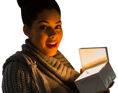 Digital png photo of biracial woman with present on transparent background - Powered by Adobe
