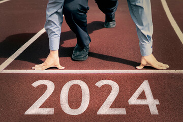 happy new year 2024. concept of starting business or career in the new year. businessman preparing for running. opening a business in 2024. transition to a new level concept