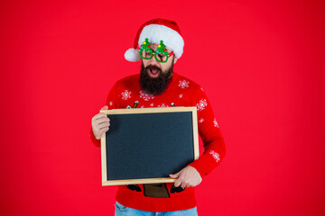 Santa man offer holiday shopping. Xmas advertisement, copy space. Christmas shopping sale. Happy...