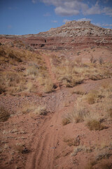Dirt bike trail through Moab Utah in desert landscape with red  buttes