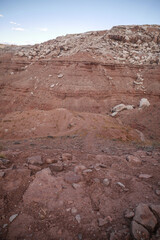 Red desert landscape near Moab Utah with rocky and buttes and layered cliffs