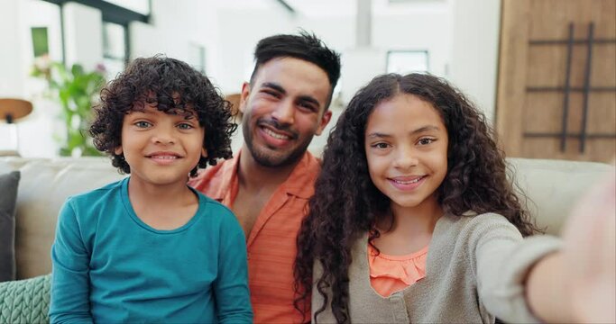 Selfie, happy and face of father and children on a sofa for bonding and relaxing together at home. Smile, love and young Indian dad taking a picture with kids in the living room of modern house.