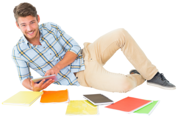 Digital png photo of caucasian man lying with notebooks and tablet on transparent background