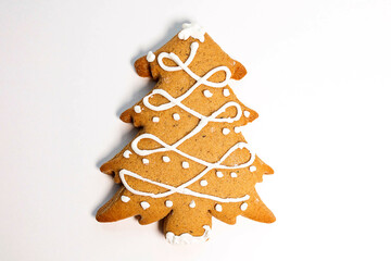 Ginger cookies in the shape of a Christmas tree, highlighted on a white background. View from above