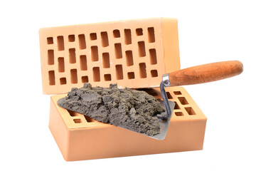 Trowel and bricks on white isolated