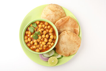 Indian food, spicy Chick Peas Curry also known as Chola/Chana Masala or Chole, served with fried puri or poori