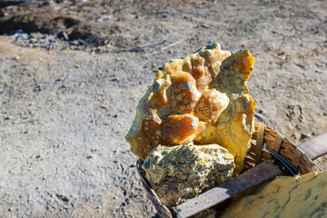 sulfuric rocks by sulfur mine at Ijen vulcano in East Java, Indonesia. Photo of unpolished sulfur mineral rocks