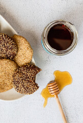 Sesame cookies on a white plate