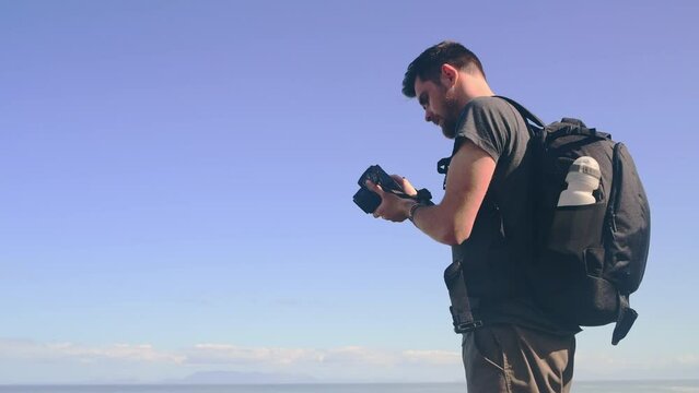 Camera picture, blue sky and nature man shooting outdoor wellness, hiking view or travel in Portugal tropical island. Lens focus, mockup photography space and memory photo of backpacking photographer