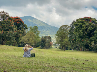Fototapeta na wymiar Woman walking and relaxing at beautyful green landscape of Handa