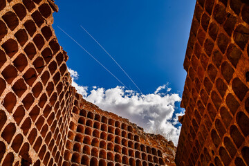 Alhambra castle dovecote and two airplane contrails