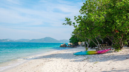 a colorful kayak on the beach of Ko Kham Island Sattahip Chonburi Samaesan Thailand a tropical island with turqouse colored ocen