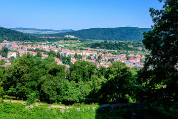 Fototapeta na wymiar Landscape with view over houses of Sighisoara city, in Transylvania (Transilvania) region of Romania, in a sunny summer day.