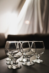 A few empty goblets on the table in the restaurant. Tablewares for banquet.