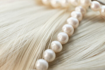Hair & Femininity: An In-depth Look at How Pearls and Soft Locks Shape the Ideal of Womanly Beauty