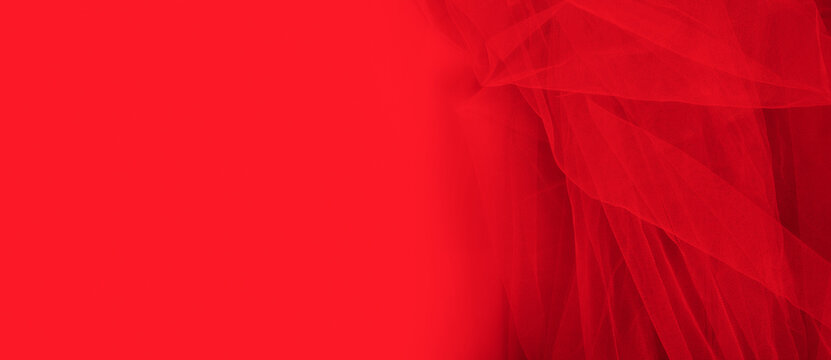 luxury folded red tulle fabric texture can be used as a wedding backdrop. Luxury Christmas background or New Year, Valentines background design.