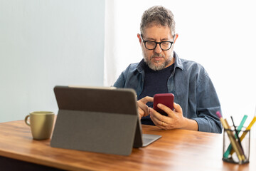 Professional Multitasking with Tablet and Smartphone - real people