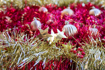 Christmas background of shiny gold and purple tinsel