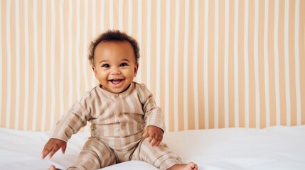 Fototapeta premium Delightful baby in morning pajamas spreads sunshine.