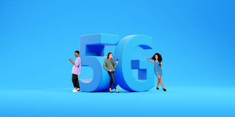 People with phones standing near 5G sign