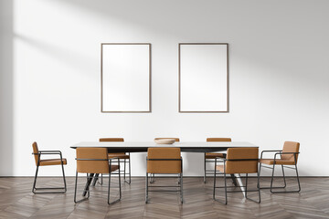 Modern white home living room interior with table and chairs. Mockup frames