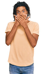 Young african american man wearing casual clothes shocked covering mouth with hands for mistake. secret concept.