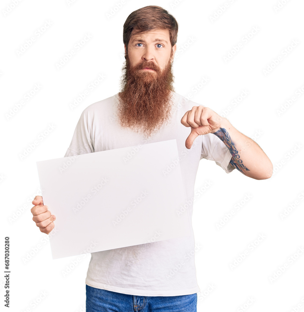 Poster handsome young red head man with long beard holding blank empty banner with angry face, negative sig