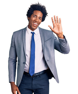 Handsome African American Man With Afro Hair Wearing Business Jacket Waiving Saying Hello Happy And Smiling, Friendly Welcome Gesture