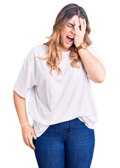 Young caucasian woman wearing casual clothes yawning tired covering half face, eye and mouth with hand. face hurts in pain.