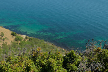 Steep mountainside near the sea with stunning views of turquoise water