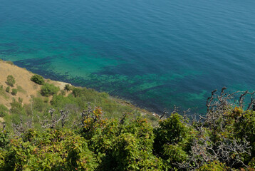 Steep mountainside near the sea with stunning views of turquoise water