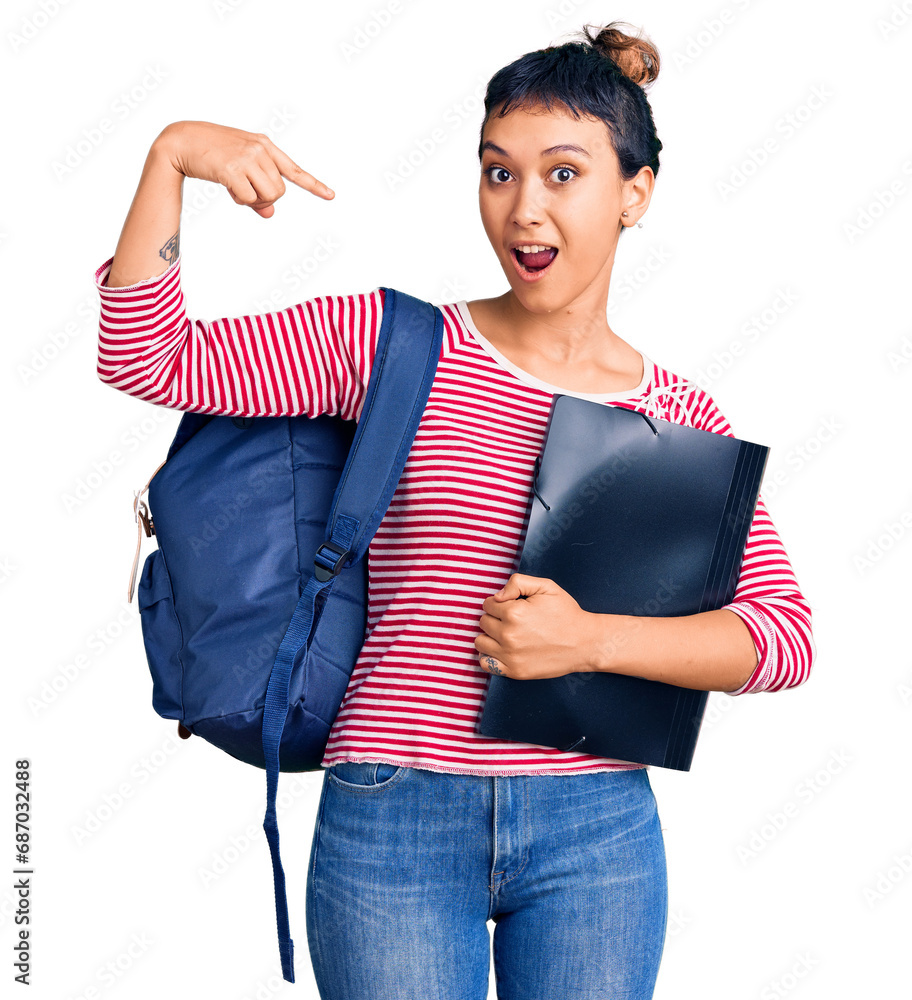 Poster young woman wearing student backpack holding binder smiling happy pointing with hand and finger