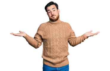 Young hispanic man wearing casual clothes clueless and confused expression with arms and hands raised. doubt concept.