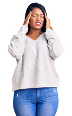 Hispanic woman with long hair wearing casual clothes with hand on head, headache because stress. suffering migraine.