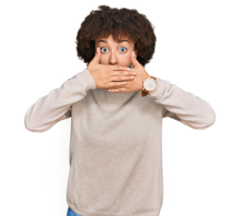 Young hispanic girl wearing wool winter sweater shocked covering mouth with hands for mistake. secret concept.