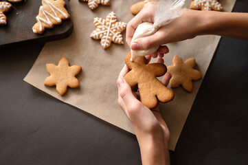 Christmas gingerbread cookie decoration with sugar icing. Soft selective focus, lifestyle
